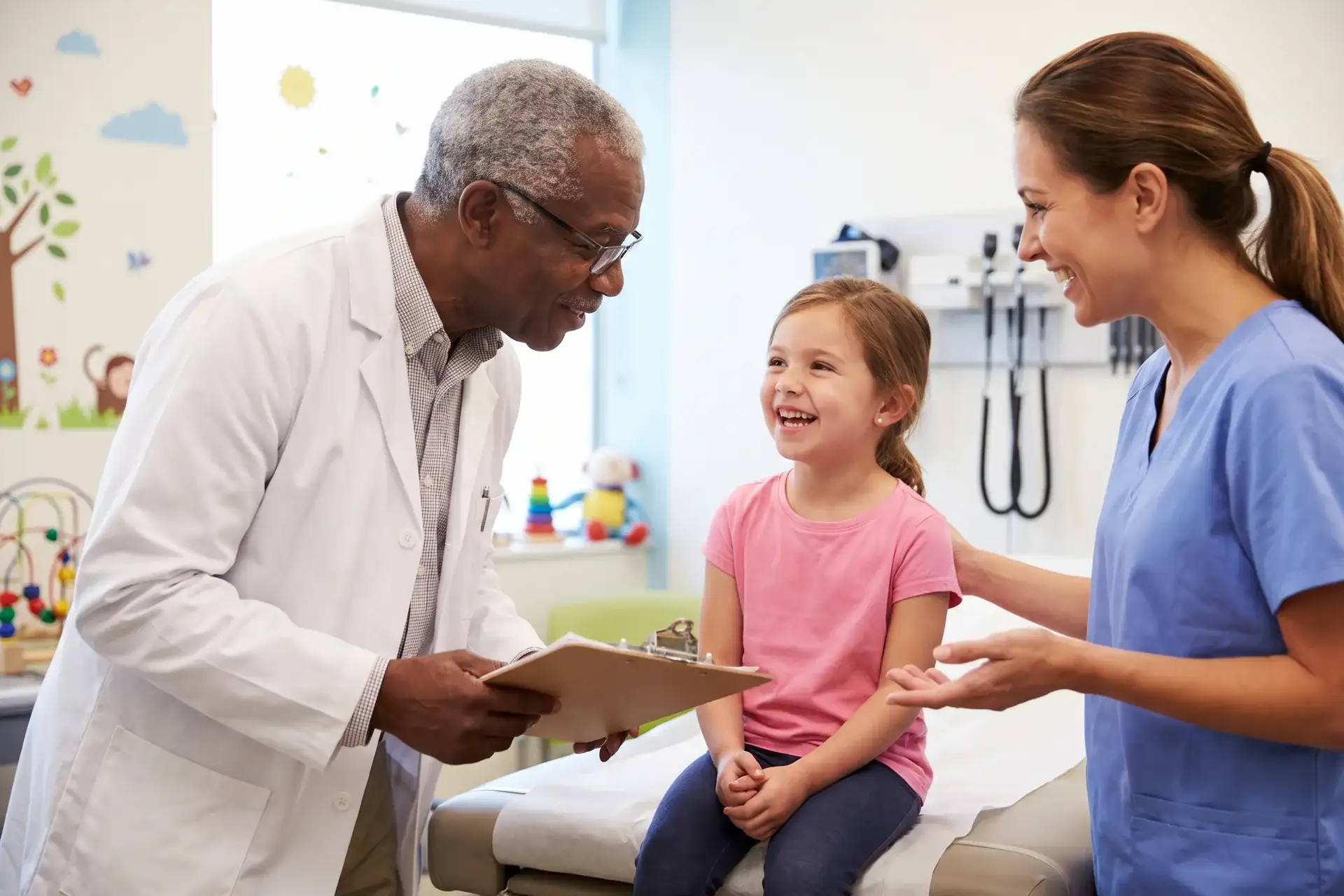 Doctor and nurse with a child patient during an annual checkup in Houston