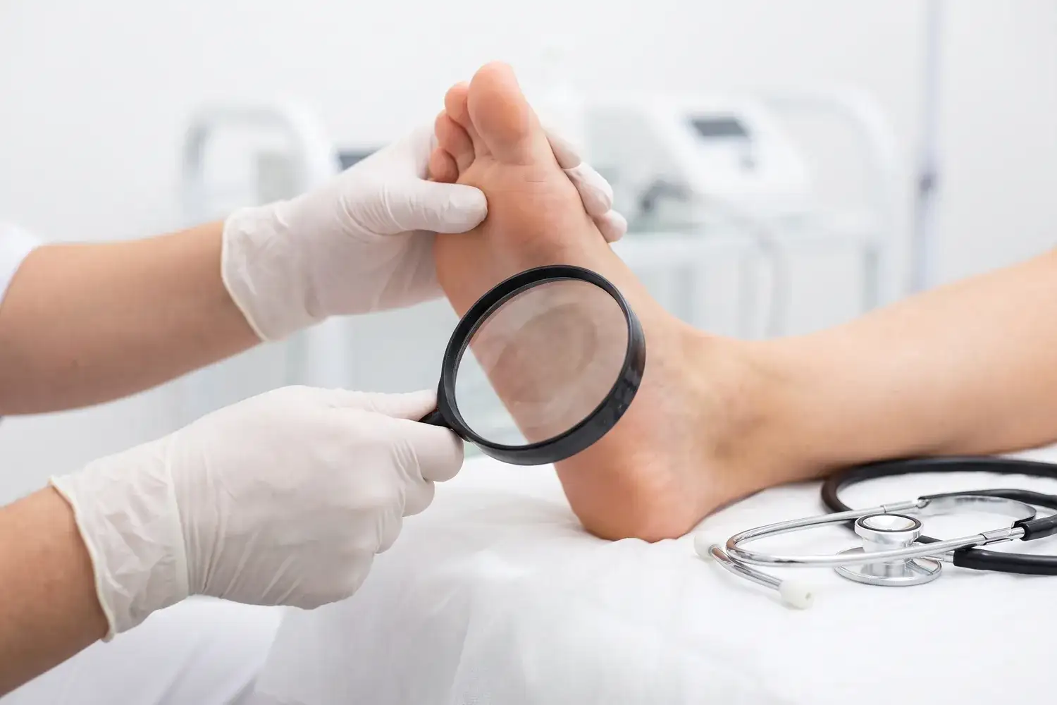 Dermatology foot skin exam with a magnifier in Houston