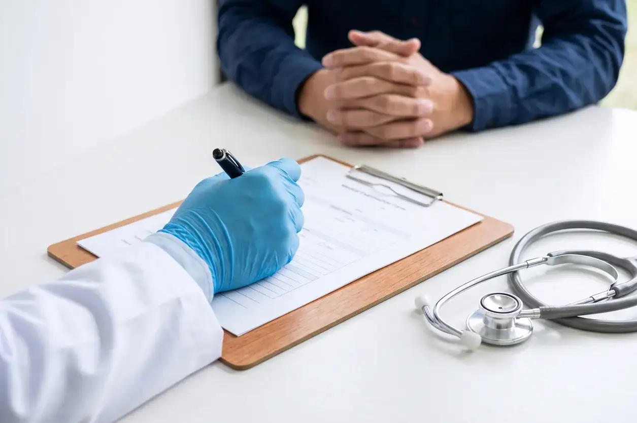 DOT physical exam form on a clipboard in Houston