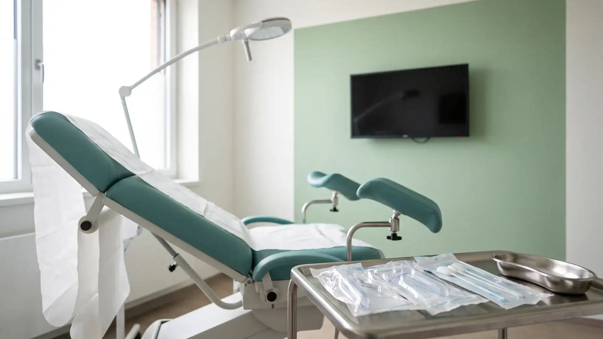 Gynecology exam room prepared for a pap smear in Houston