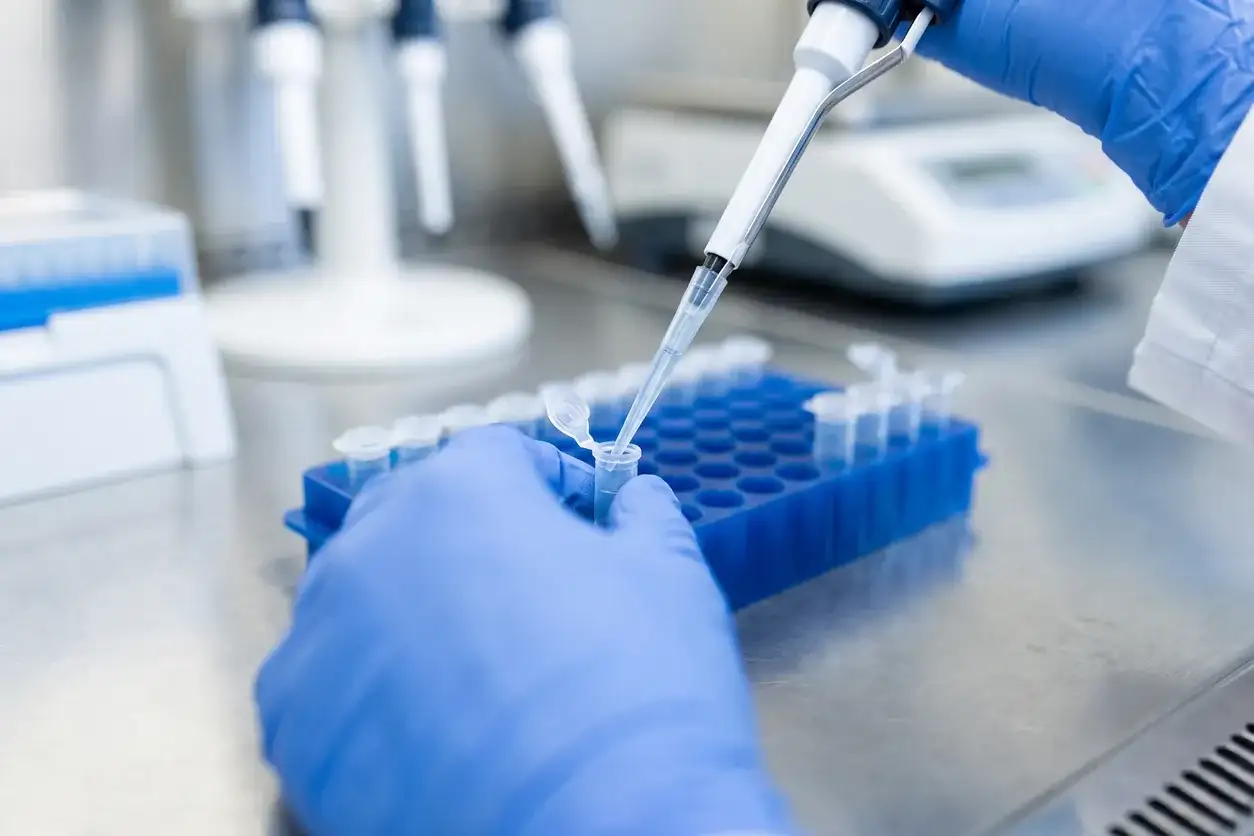 Laboratory technician pipetting blood samples in Houston
