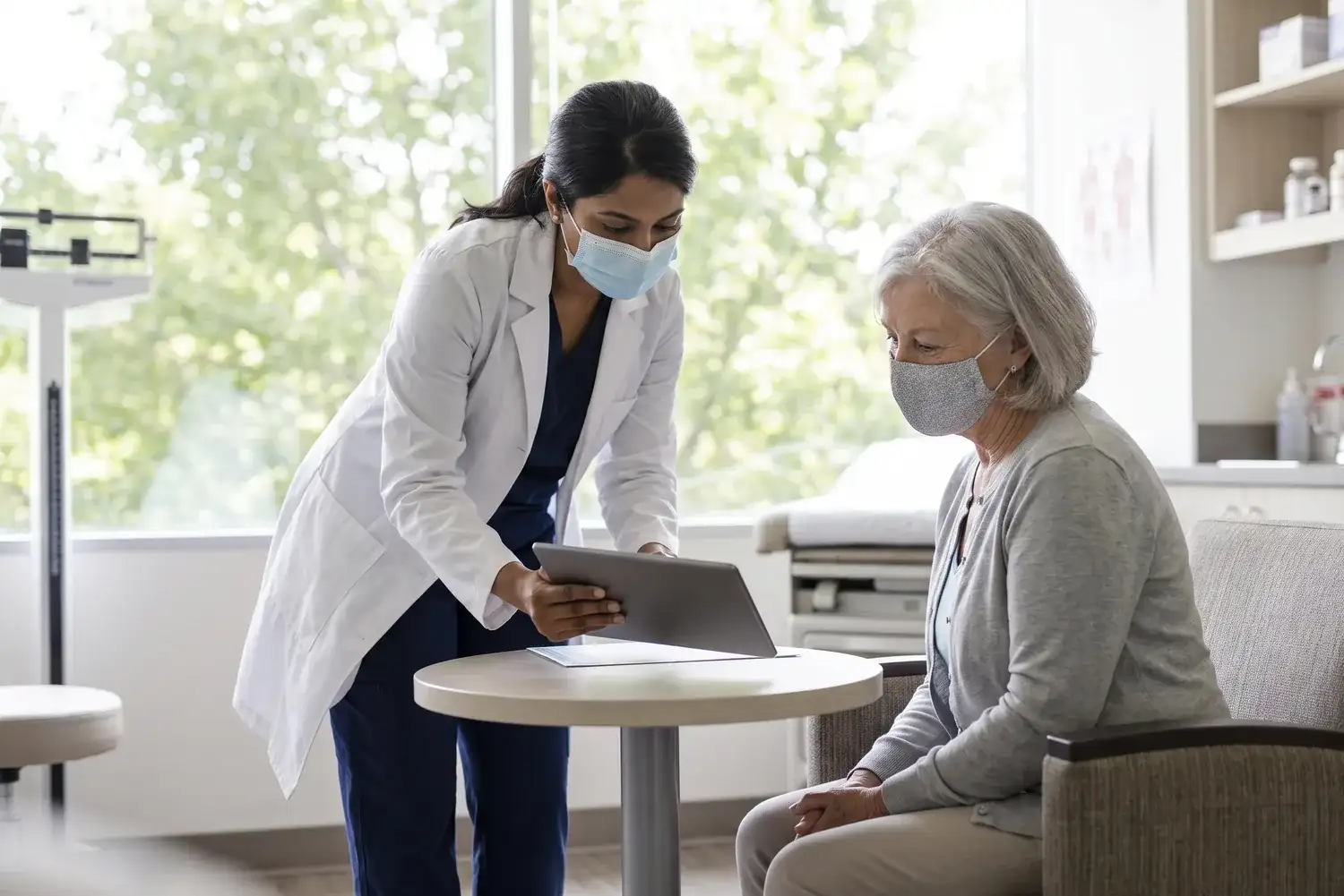 Physician explaining treatment to a senior patient in Houston