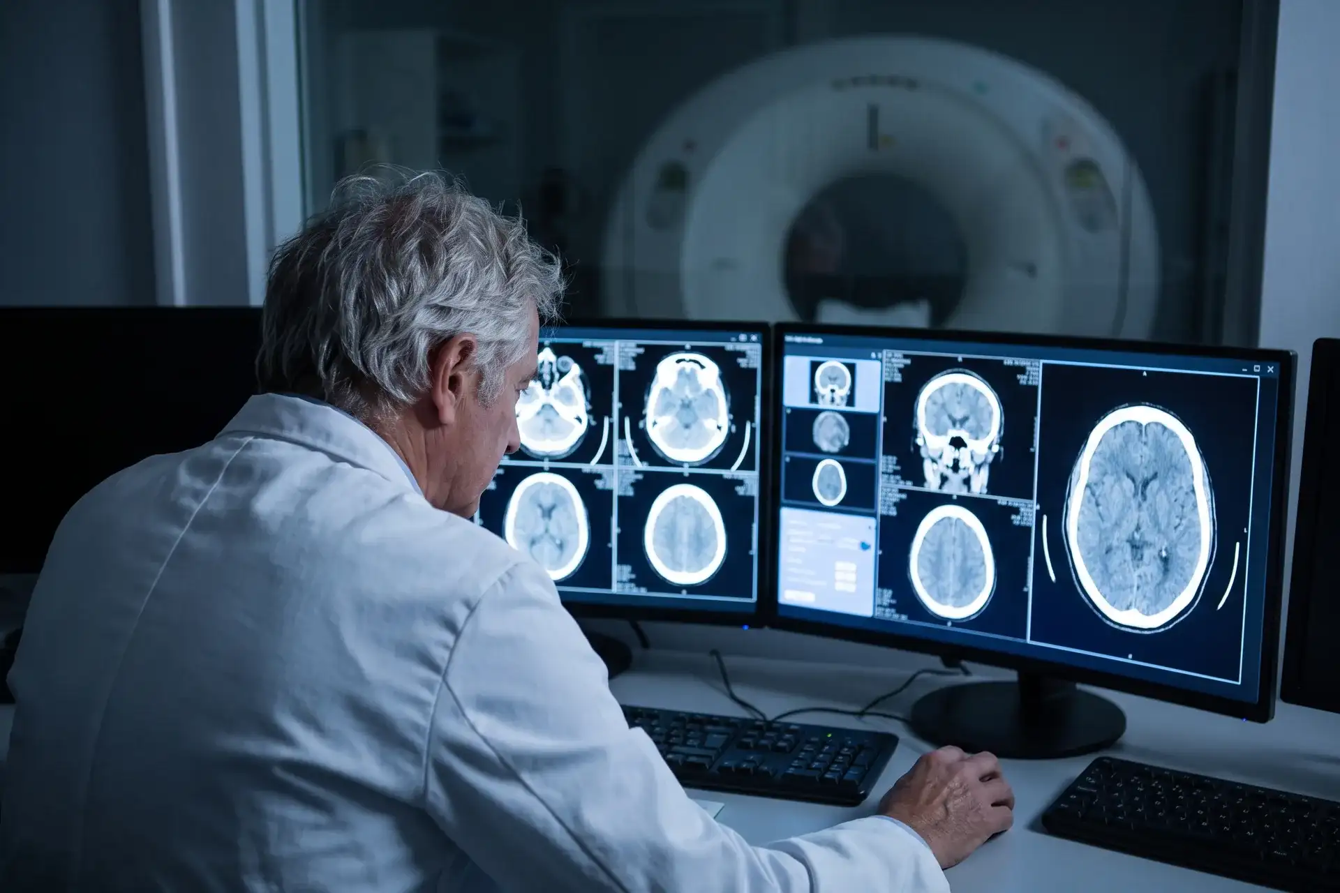 Radiologist reviewing CT scan images in Houston
